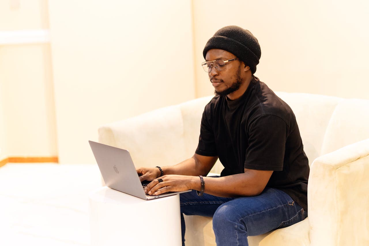African freelancer working remotely on a laptop